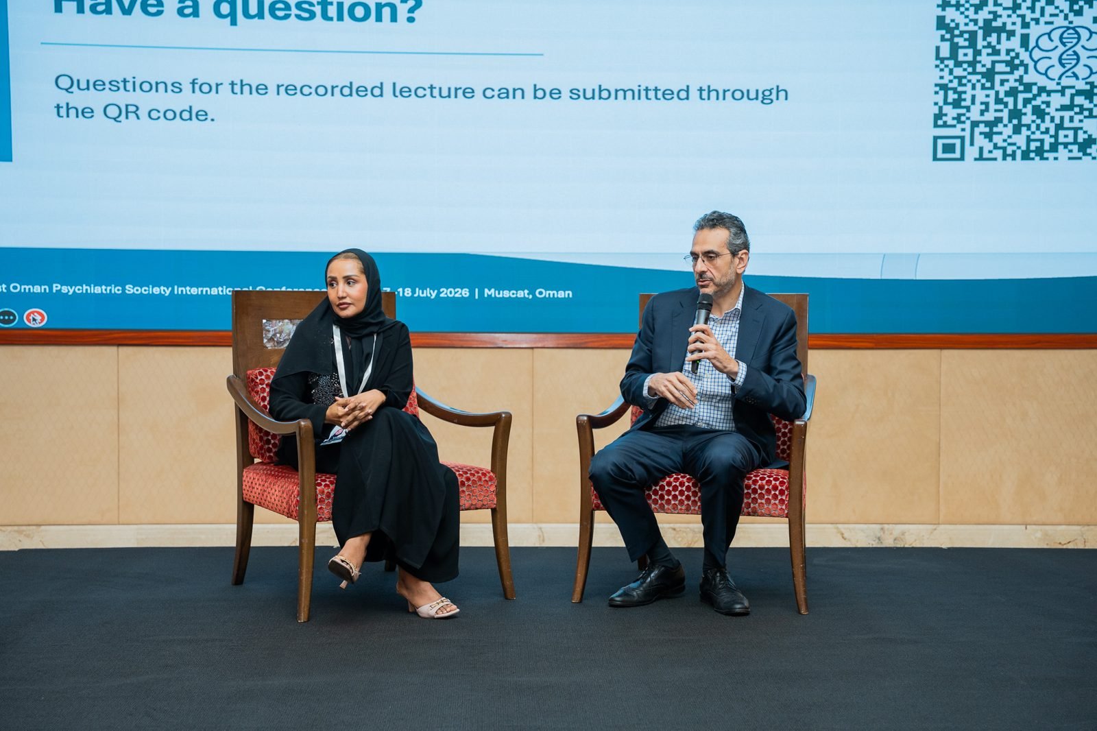 Speakers on stage during a panel discussion at OPS2026
